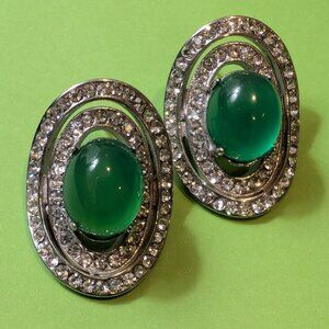 Beautiful glass/stone stud earrings of green, double encircled in crystals.
